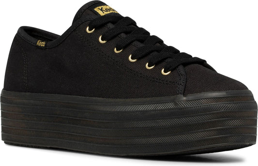 Black canvas sneaker with thick, stacked platform sole and gold-toned eyelets. The word "Keds" is visible on the heel.