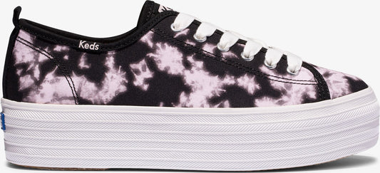 A platform sneaker with a tie-dye pattern of black and light pink.