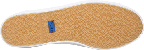 The sole of a shoe is textured in tan color, with a white stripe and a blue rectangle.