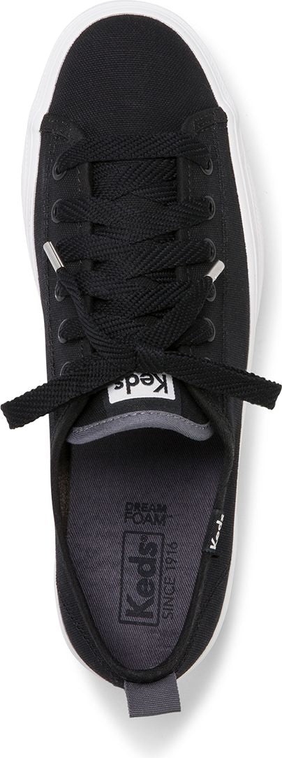 A top-down view shows a black canvas shoe with white sole and black shoelaces.