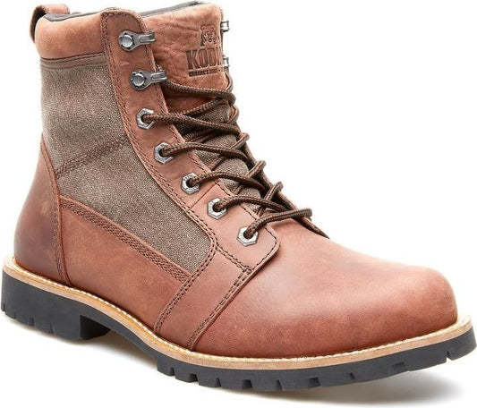 A brown leather and canvas work boot with metal eyelets.