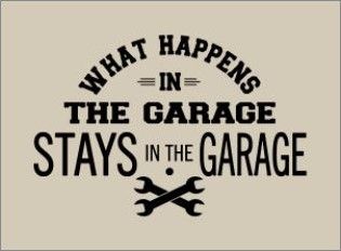 A sign that reads: 'What happens in the garage stays in the garage' above crossed wrenches.