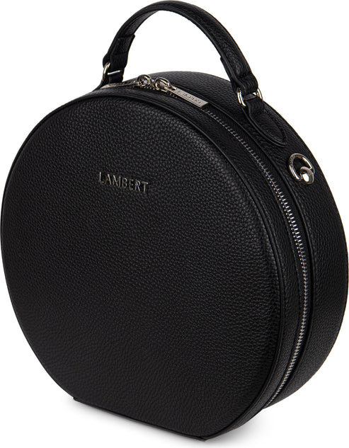 Round black purse with top handle and zipper.