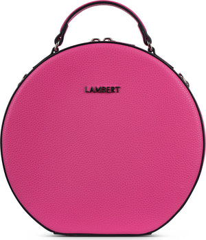 Round, bright pink purse with a top handle and the word LAMBERT on the front.