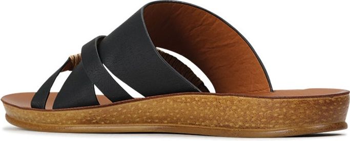 A pair of black strappy sandals with a brown sole.