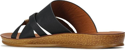 A pair of black strappy sandals with a brown sole.