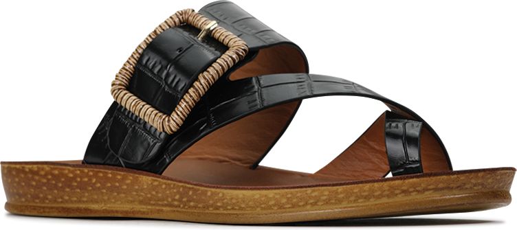 Black sandal with large buckle detail.