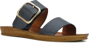 A sandal with two straps and a gold buckle.