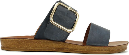 A blue sandal with a large gold buckle.