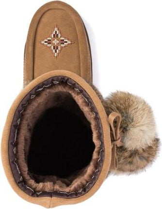 Tan suede moccasin slipper lined with fur, a beaded star design, and a fur pom-pom.