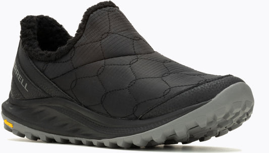 Slip-on shoe with quilted upper, faux fur collar, grey sole, and logo at the heel.