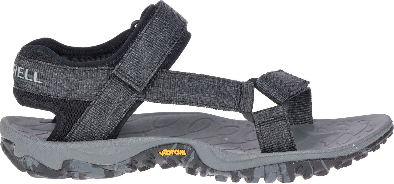 A sandal with adjustable straps over a gray sole.