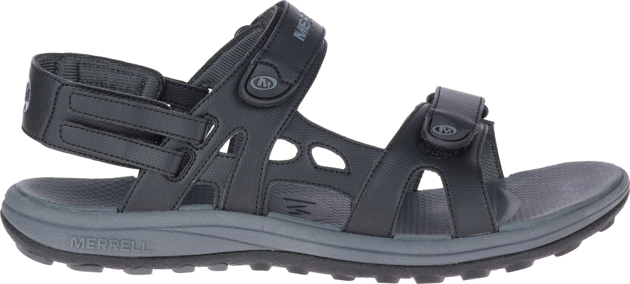 A black sandal with straps and the word "MERRELL" visible on the sole.