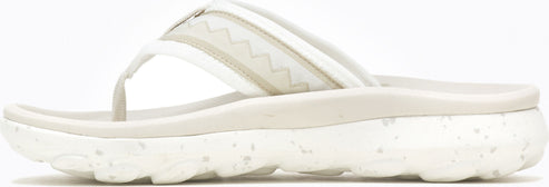A white sandal with a thick, speckled sole.