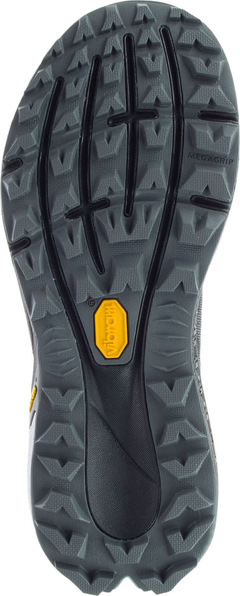 Bottom of a shoe with gray rugged sole and a small yellow vibram label.