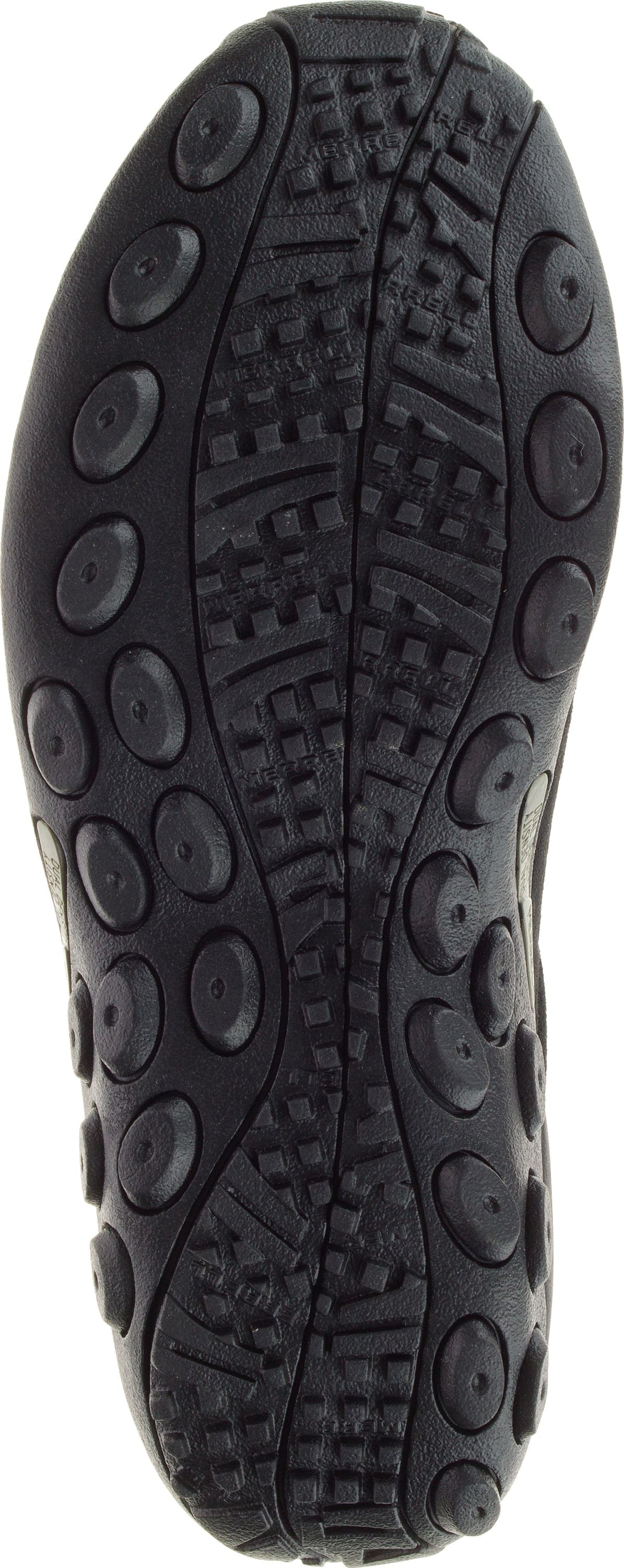 Sole of a shoe with textured treads and circular protrusions.