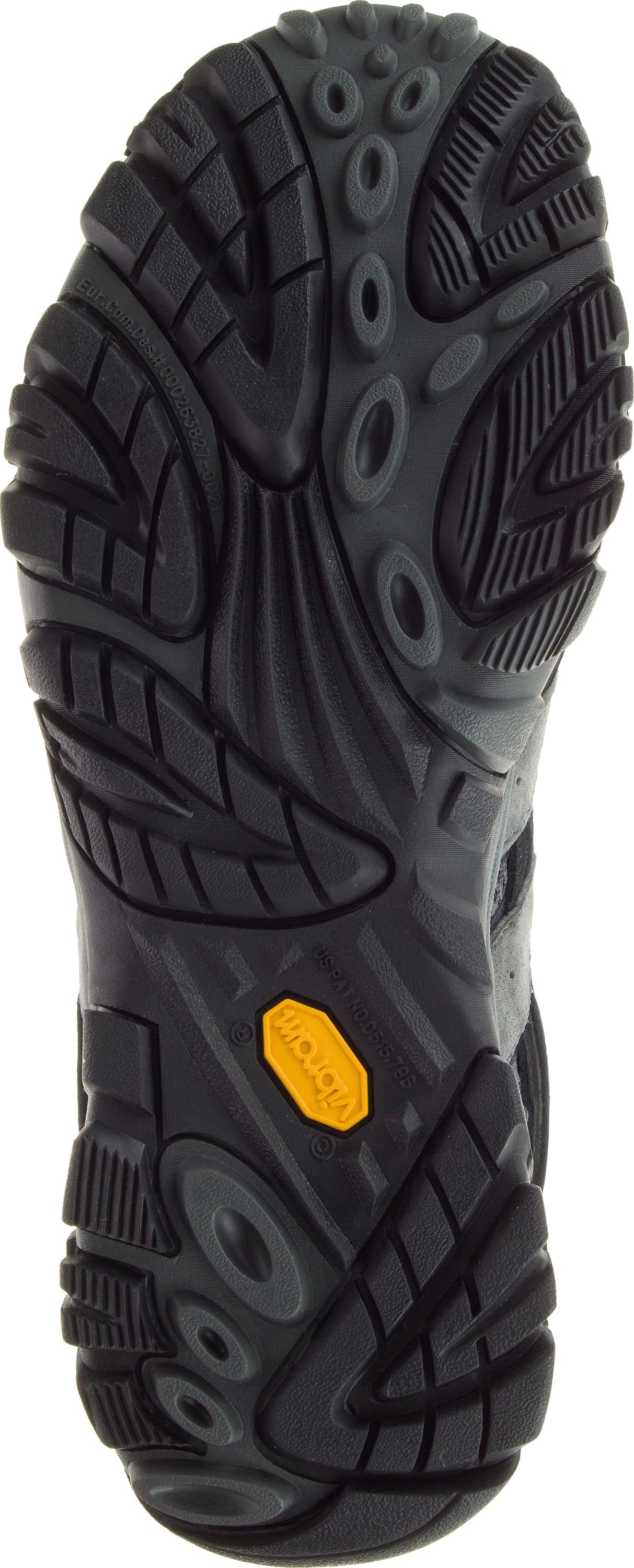 A shoe's rugged black sole featuring a yellow logo.