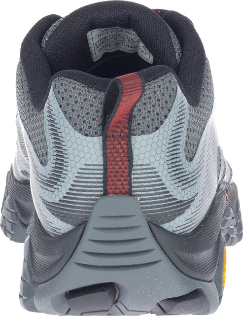 Back view of a gray trail running shoe with black collar and a red heel pull loop.