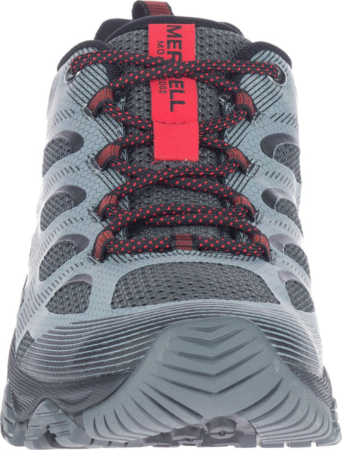 The front view of a gray hiking boot with red shoelaces that reads 'MERRELL' vertically in red.