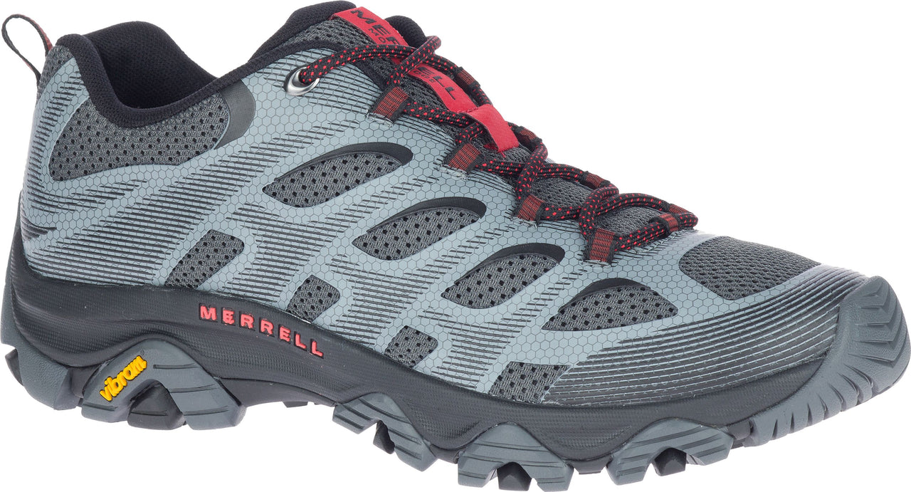 Gray hiking shoe with black sole and red laces.