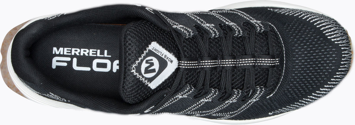 A top-down view of a black sneaker with white laces and white text that reads "MERRELL FLOAT."