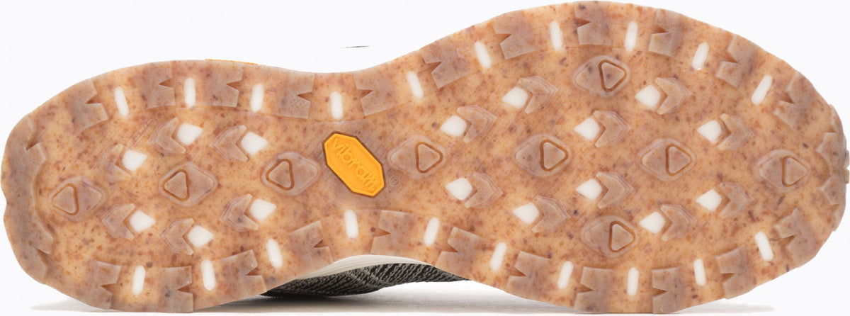 A shoe sole with a repeating pattern of triangles and rectangular blocks.
