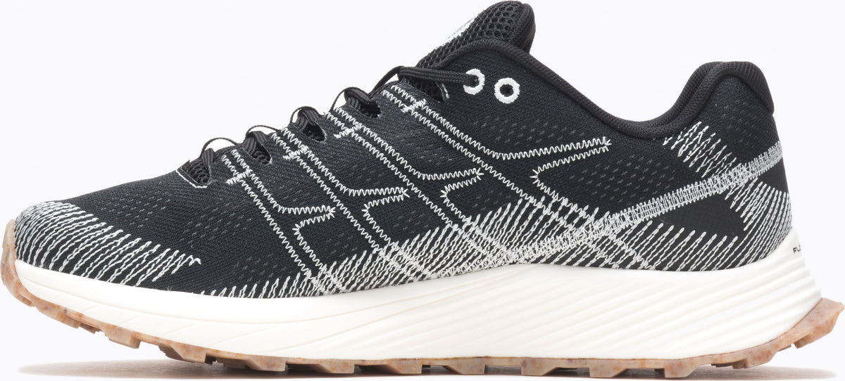A black running shoe with white laces and a white sole.