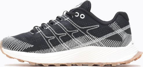 Black sneaker with white crisscross patterns on the upper and a tan sole.