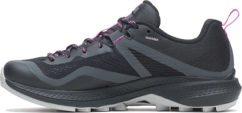 A dark colored trail running shoe with pink accents.