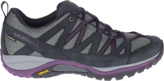 A waterproof hiking shoe with black and purple accents and Vibram sole.
