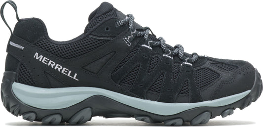 A black hiking shoe with gray sole and white laces, and the word MERRELL in white on the side.