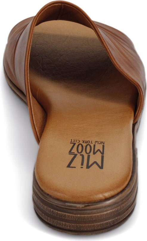 Brown sandal with flat heel and imprinted text 'MIZ MOOZ NEW YORK CITY' on the insole.