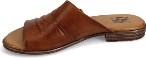 A brown leather sandal with a low heel.