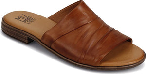 A light brown leather sandal with a low heel and a gathered band across the top.