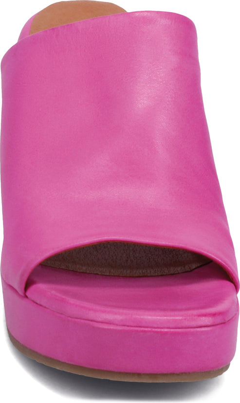 Hot pink leather heeled clog-style shoe with platform sole.