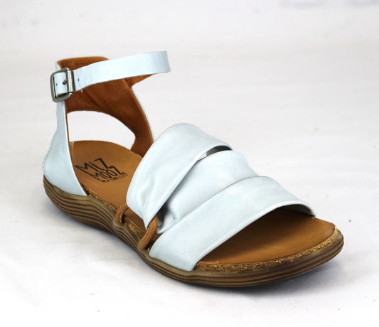 A light blue sandal with a flat heel and ankle strap.