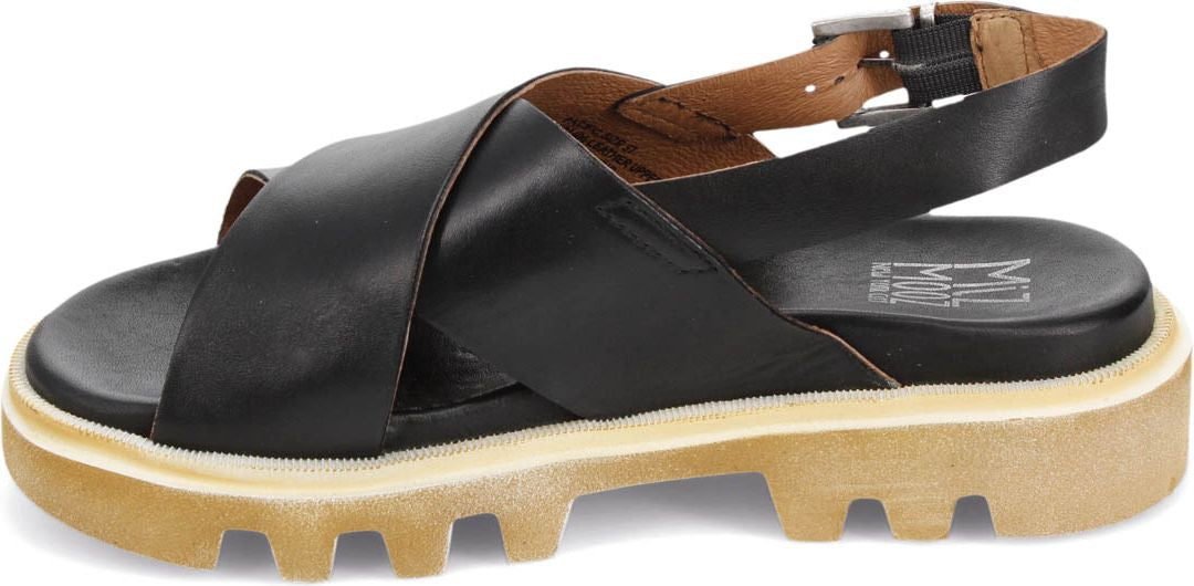 A black sandal with criss-cross straps and a buckle.