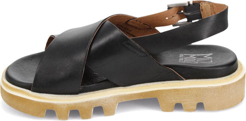 A black sandal with criss-cross straps and a buckle.