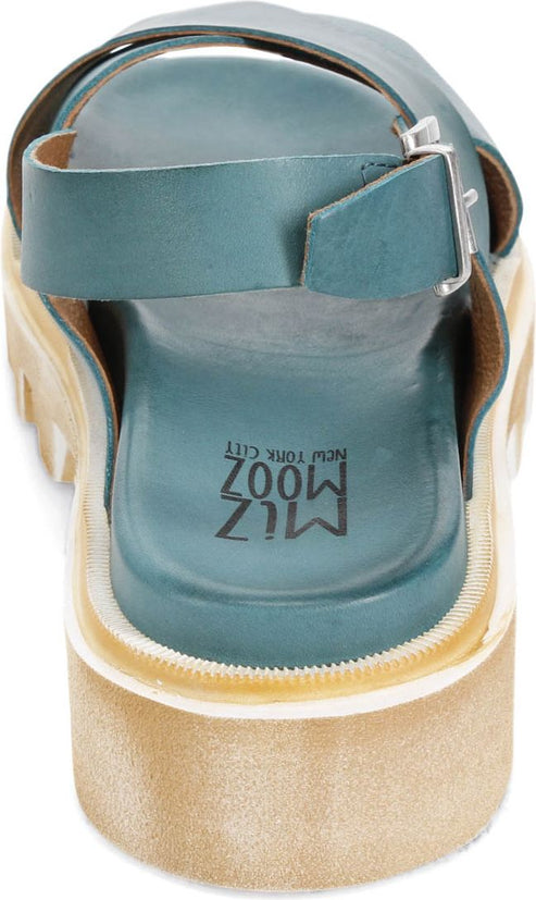 Teal Miz Mooz sandal with adjustable buckle at the ankle, treaded sole, and "MIZ MOOZ NEW YORK CITY" stamped on the inner heel.