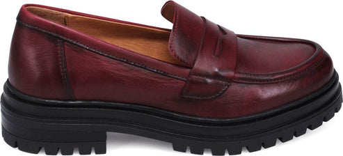 A burgundy leather loafer with a thick black sole.