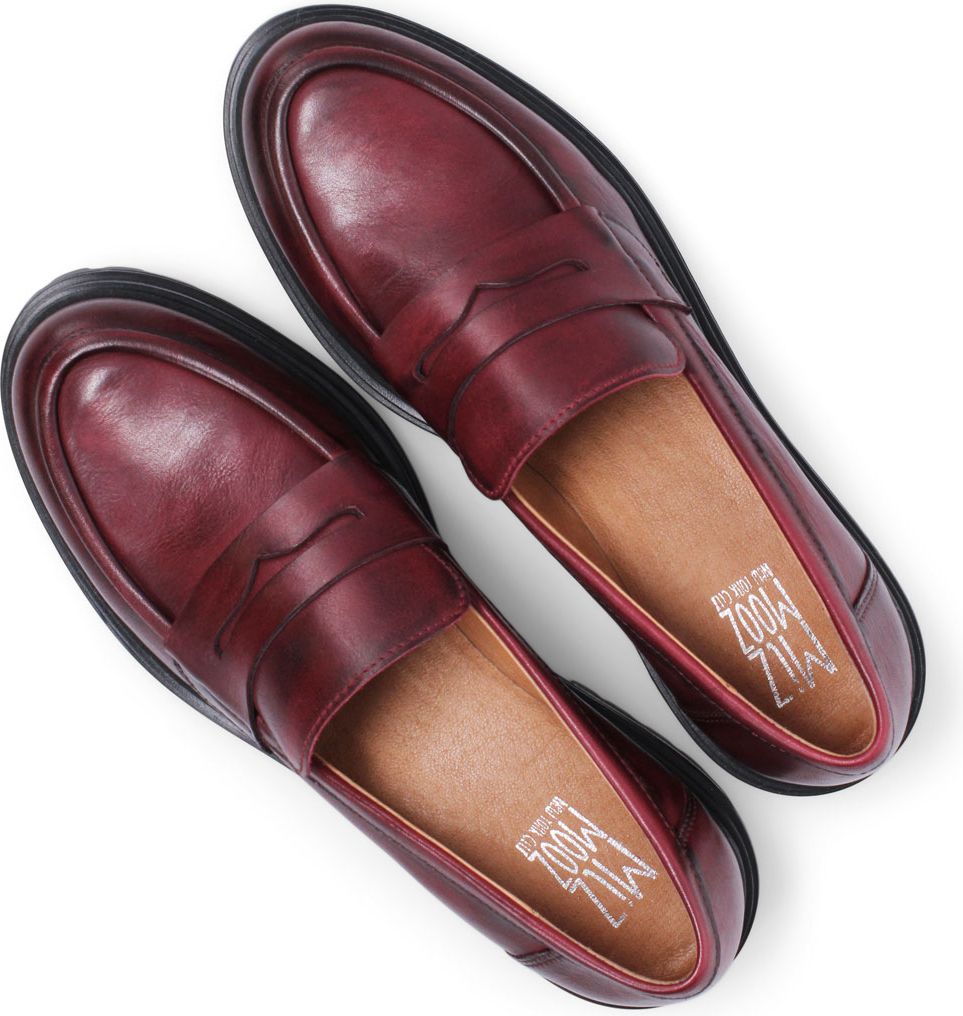Pair of dark red leather penny loafers with black soles.