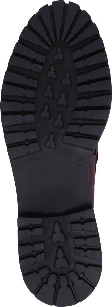 The sole of a shoe with a thick, treaded black rubber bottom.