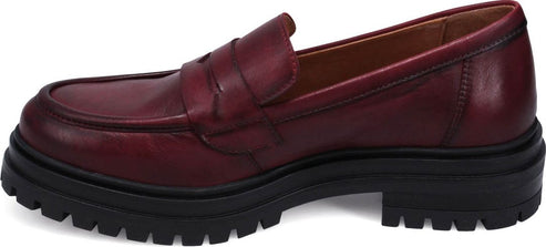 A burgundy leather loafer with a black lug sole.