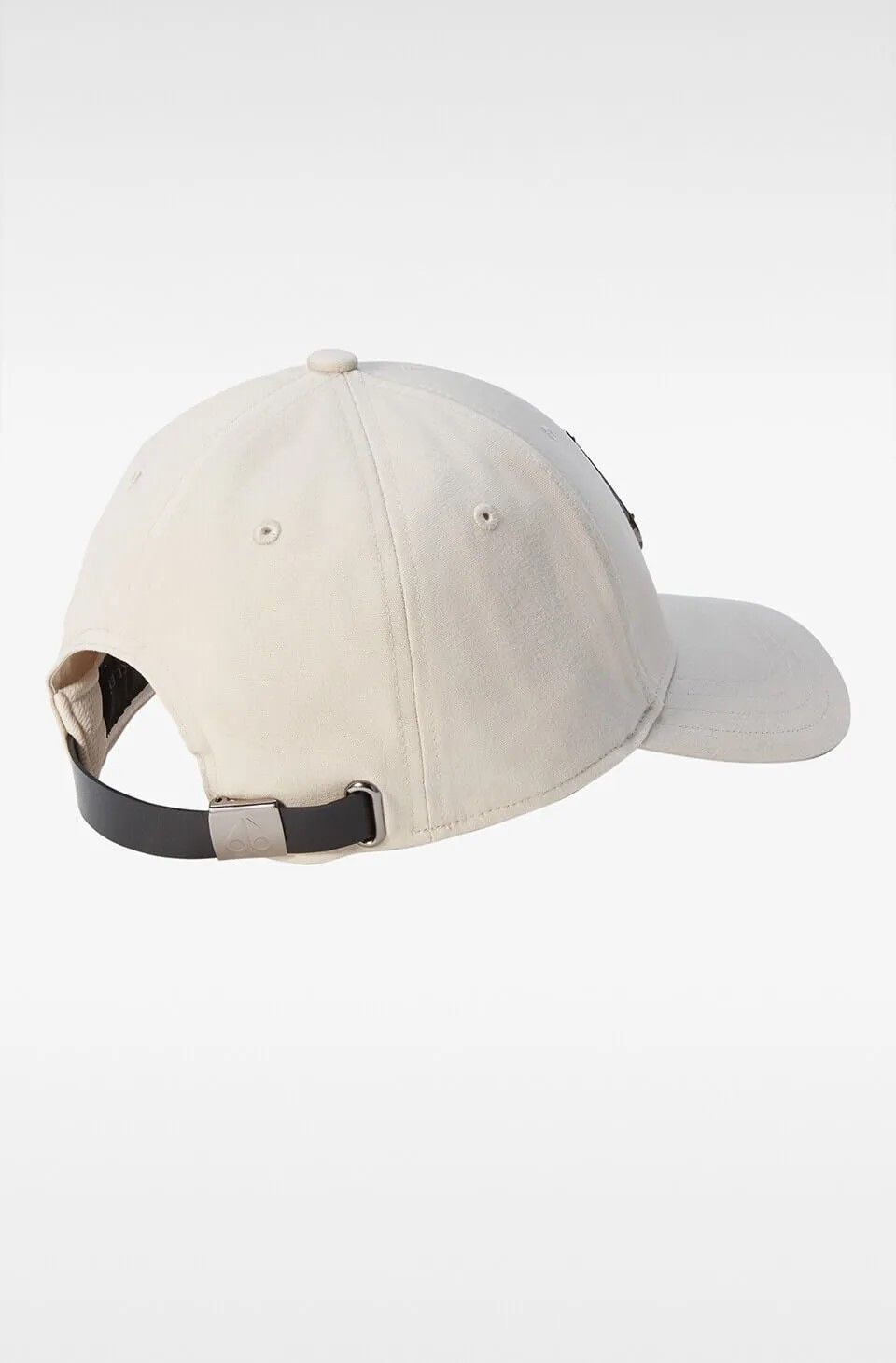 Side view of a light-beige baseball cap with a black adjustable strap.