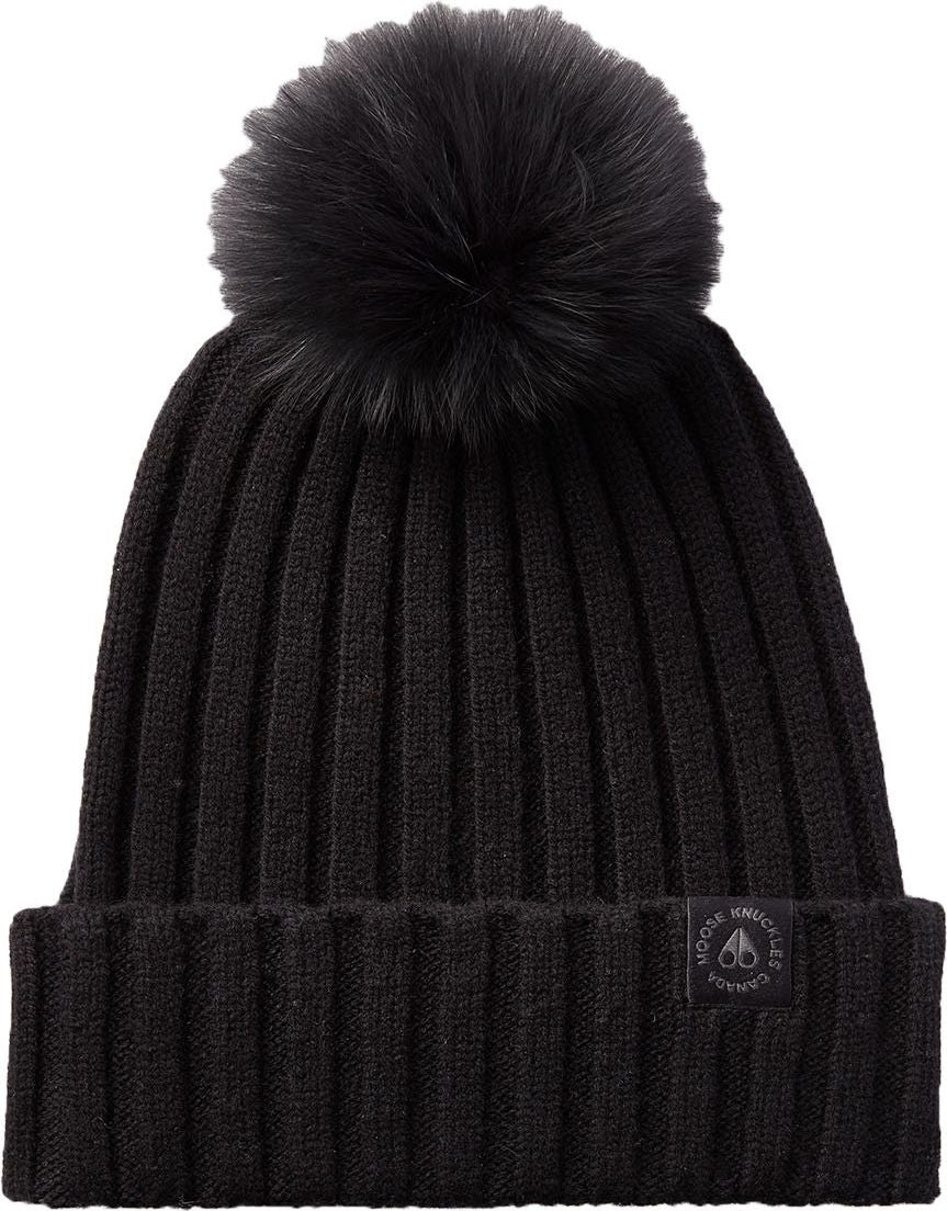Black ribbed knit beanie with a black pompom on top and a dark patch on the turned up brim.