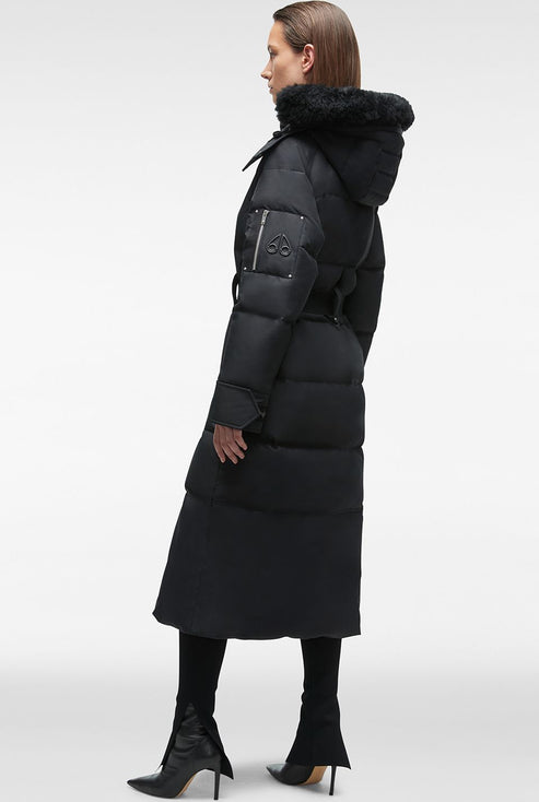 A long black down coat with a fur-trimmed hood and belt.