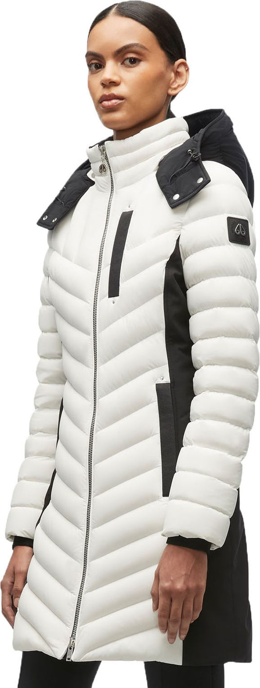 A woman wearing a black and white puffer coat.