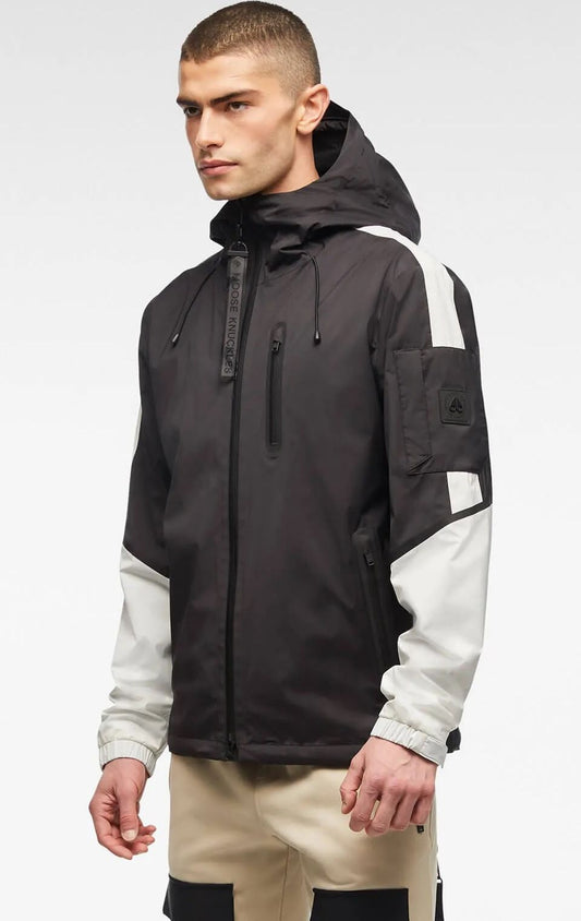 Man in black and white windbreaker jacket with hood.