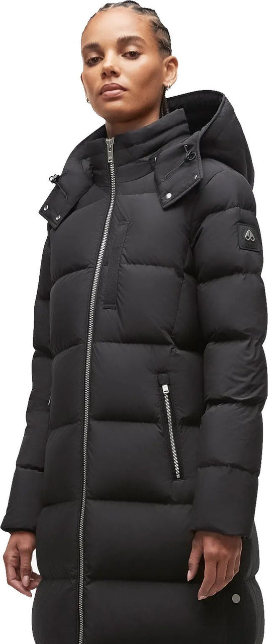 A person wears a black puffer coat with a hood and a silver zipper.