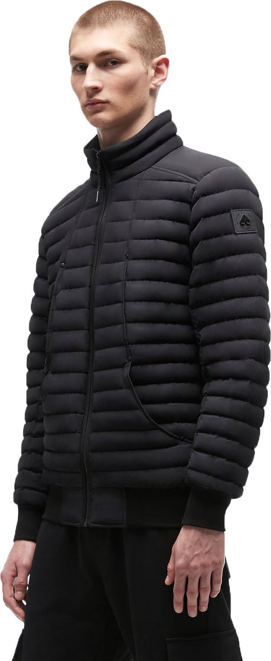 A man wearing a black puffer jacket with a zipper.